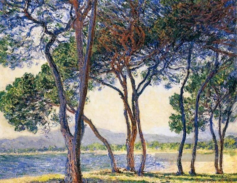 Arbres au bord de la mer à Antibes Claude Monet paysage ruisseaux Peintures à l'huile
